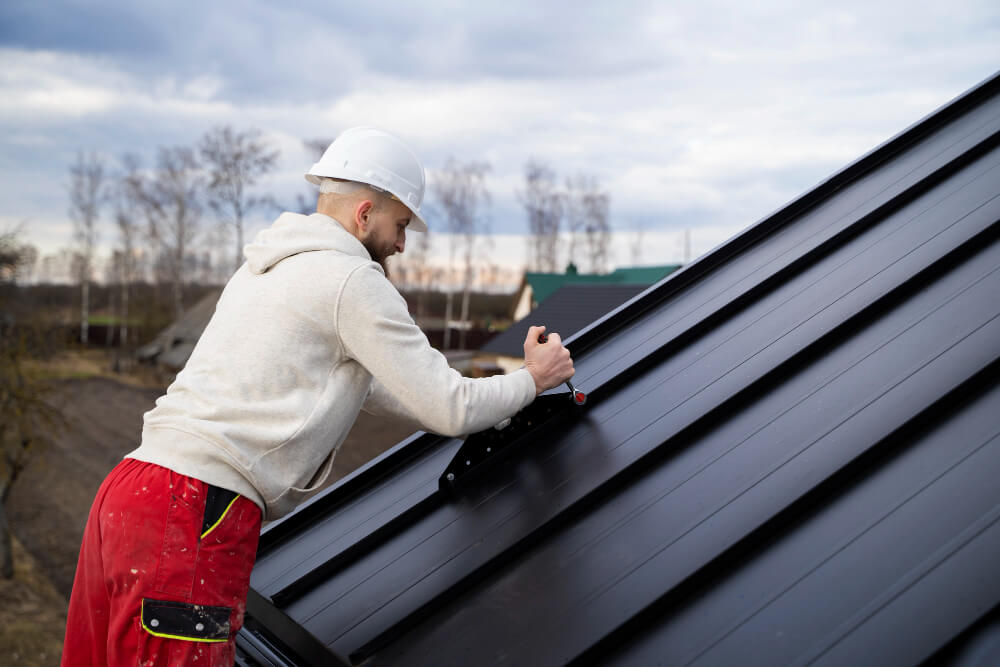 Two Long Eaton Roofers inspecting a completed ridge line